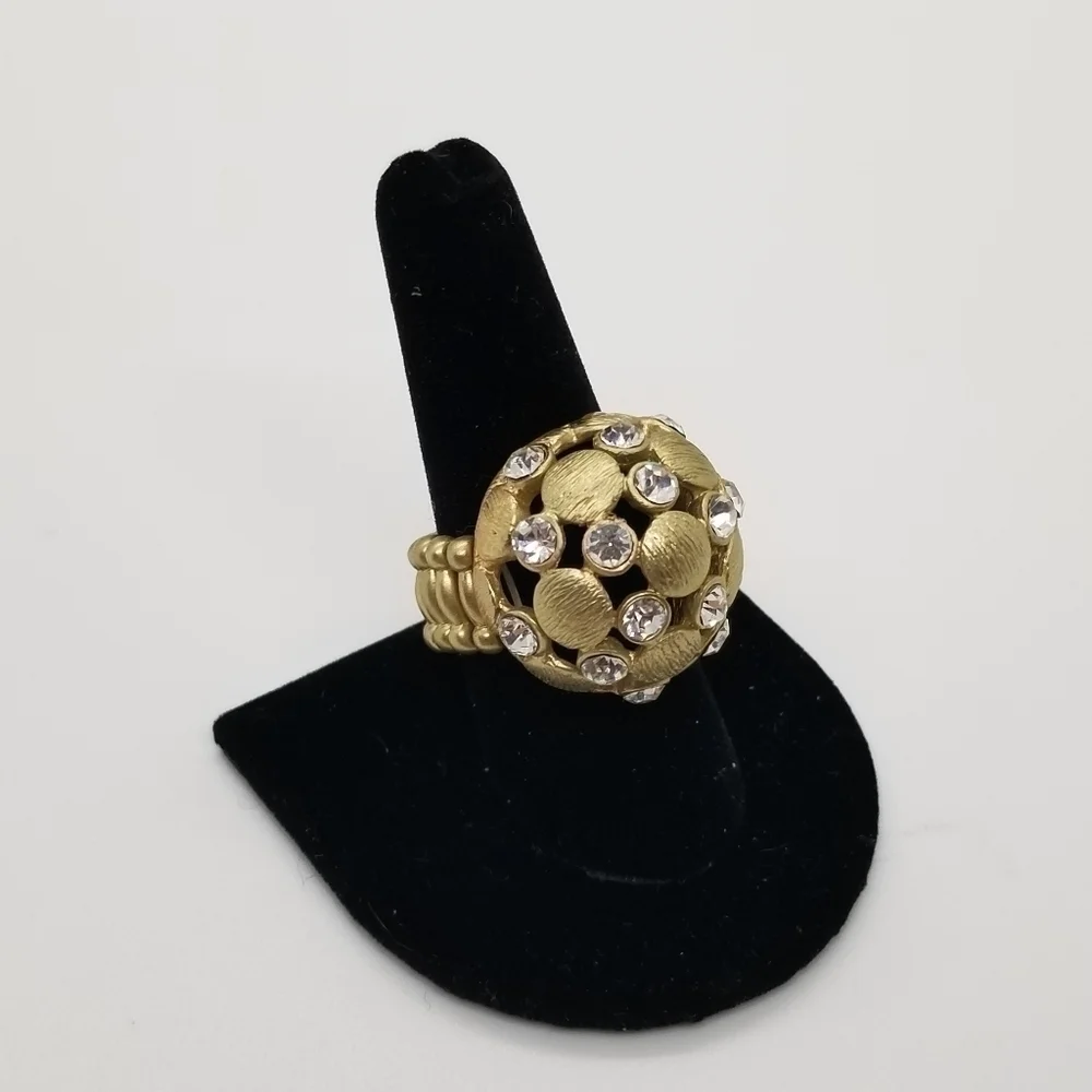 brushed gold tone dome stretch ring with crystal accents